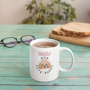 Sticker mockup featuring an 11 oz poodle mug on a green wooden desk
