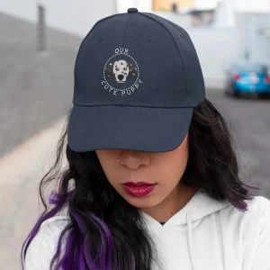 Mockup of a purple haired woman covering half her face with a dalmatian dad hat