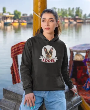 Personalized hoodie mockup featuring a woman posing in front of a lake