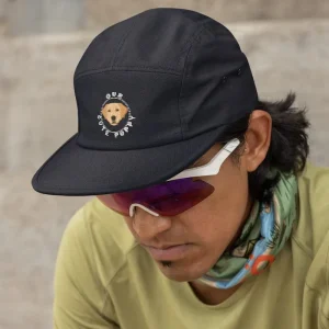 Our Cute Puppy 5 Navy Labrador dad hat mockup featuring a man resting after a run