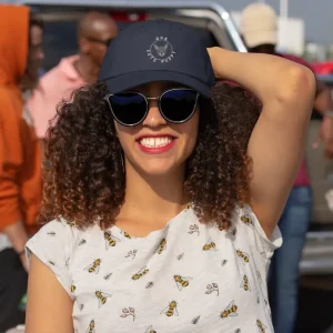 Our Cute Puppy 8 Chihuahua dad hat mockup of a curly-haired woman at a tailgate party