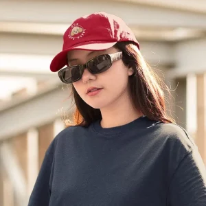 Our Cute Puppy 8 Poodle dad hat mockup featuring a cool young woman on the street