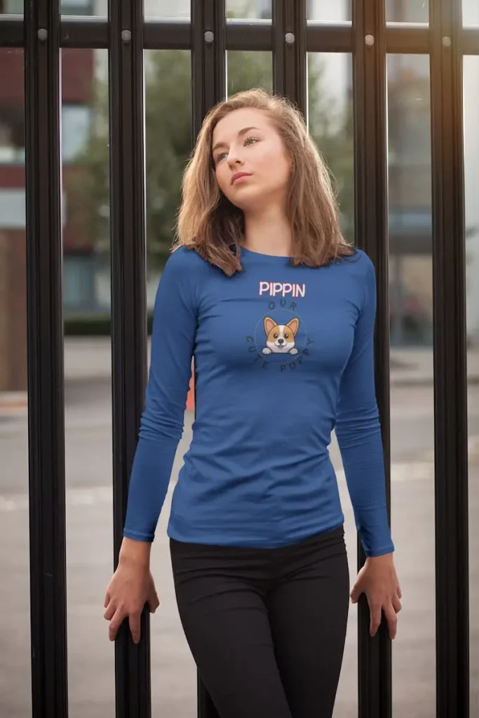 Genuine Corgi Long-Sleeve Shirt - Custom Dog Name Gift 5 Corgi long-sleeve shirt mockup of a young woman posing by a metal fence